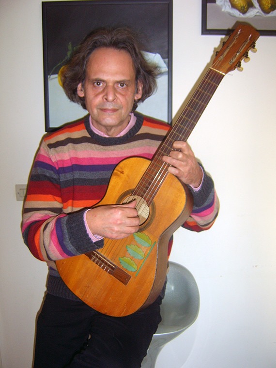 Roland Dyens holding his first guitar.  Photo courtesy of Roland Dyens.