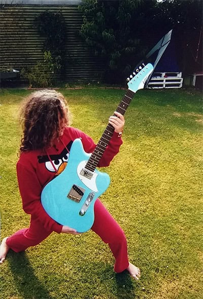 Jasmine with a Jailbird Guitar.A